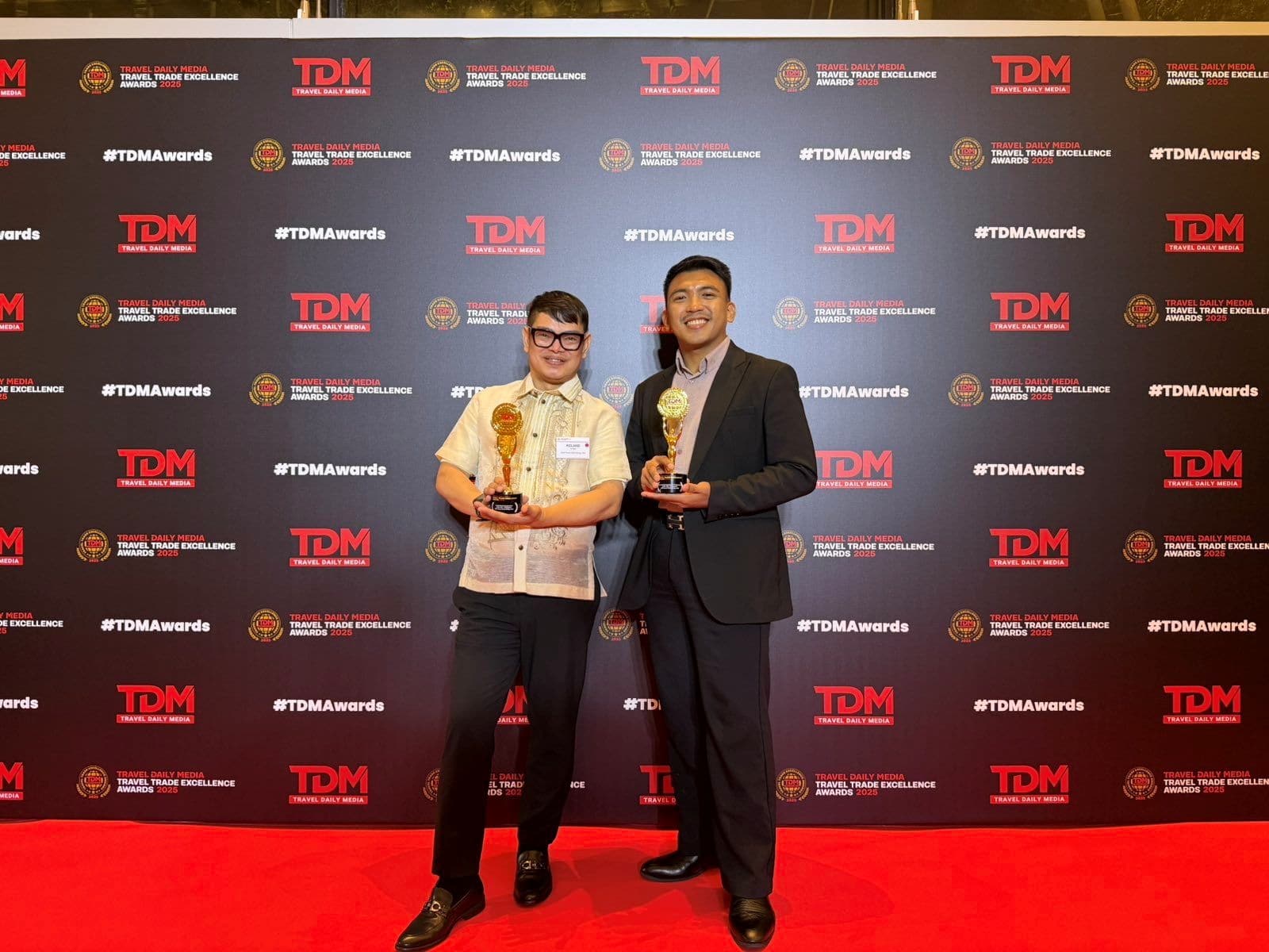 2GO Travel AVP for F&B, Ancillary, and Hotel Operations Roland Sunga and 2GO Travel Head of Product Development and Senior Brand Manager George Clayton P. Narag accepted two TDM Travel Trade Excellence Awards in Singapore.